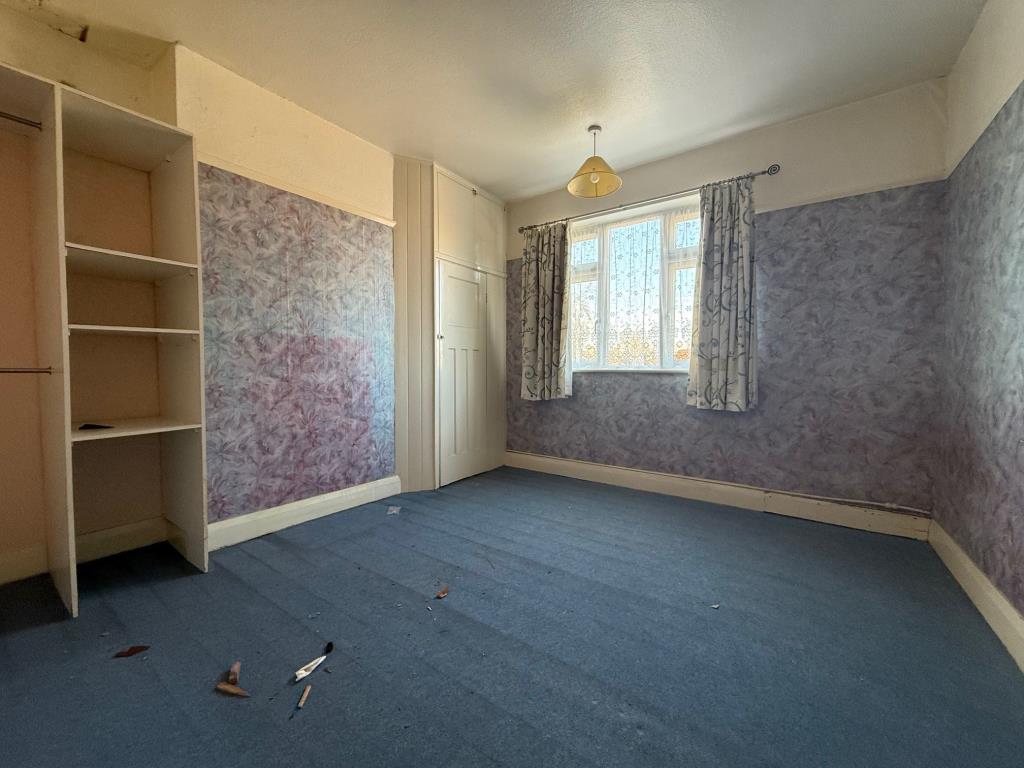 Lot: 109 - THREE-BEDROOM TERRACE HOUSE FOR IMPROVEMENT AND REFURBISHMENT - Double bedroom with window to rear aspect